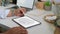 Male freelancer working with mock up digital tablet on modern worktable