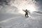 Male freerider slipping on board on snowy mountain