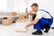 Male Furniture Assembler Repairing Wooden Shelf Using Screwdriver Indoor