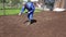 Male gardener in gumboots hands sowing planting new grass lawn. Panorama