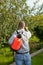 Male gardener spraying trees