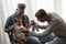 Male gay couple with adopted baby girl at home - Two handsome fathers playing with their daughter - Lgbtq+ family at home -