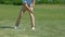 Male golf beginner player trying to hit ball, practicing on course, slow-motion