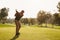 Male Golfer Lining Up Tee Shot On Golf Course