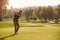 Male Golfer Lining Up Tee Shot On Golf Course