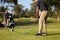 Male Golfer Lining Up Tee Shot On Golf Course