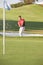 Male Golfer Playing Bunker Shot