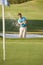 Male Golfer Playing Bunker Shot