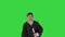 Male graduation student smiling and tossing up his hat over on a Green Screen, Chroma Key.