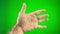 male hairy hand on a green chroma key turns the palm opening it releasing it draws a circle on green background you can