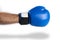 Male hand in a blue boxing glove on a white background. Boxing kick