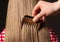 Male hand combing beautiful long hair