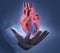 Male hand with a floating luminous heart