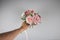 Male hand giving wedding bouquet