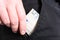 Male Hand Grabbing A 50 Euro Bill Out Of The Pocket Of A Black Jeans Trouser- Poor Man Concept