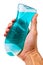 Male hand holding bottle with blue shower gel.