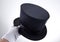 Male hand holding classic top hat