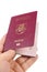 Male hand holding lithuanian passport