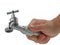 Male hand holds faucet  on white background, concept of hardworking craftsman doing good job