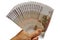 The male hand holds the Russian banknotes a fan. Isolated on a white background