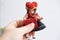 male hand holds vintage, old-fashioned German doll in national dress, Abandoned, spoiled childhood, nostalgia, puppet therapy,