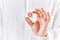 Male hand holds a wooden cube with Star of David symbol. Judaism and Israel