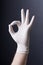 Male hand in latex glove OK sign