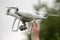 Male hand launches / catches professional drone quad copter DJI Phantom 4 Pro with digital camera 4K