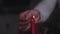 Male hand lights the festive candles in slow motion