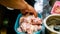 Male hand mixing the chicken meat with vinegar in a plastic food container