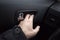 Male hand opens the car door with inner handle