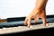 Male hand  plays on piano keyboard