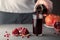 Male hand pouring pomegranate juice into a glass.