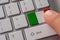 Male hand pressing keyboard button with flag of Italy on it. Online international business concept