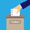 Male hand puts in a ballot box for feedback