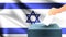 Male hand puts down a white sheet of paper with a mark as a symbol of a ballot paper against the background of the Israel flag, is