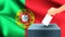 Male hand puts down a white sheet of paper with a mark as a symbol of a ballot paper against the background of the Portugal flag,