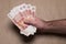 Male hand with russian money studio image. Man`s hand holds Russian rubles.