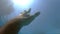 Male hand stretches from under the water to sunrays. Arm asking for help and trying to reach to the sun. Point of view