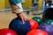 Male hand taking ball from bowling machine