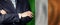 Male hands against Irish flag background, business, politics and education in Ireland