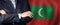 Male hands against Maldivian flag background, business, politics and education in Maldives concept