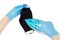 Male hands in blue disposable nitrile gloves iron a black reusable face mask. Washable cloth mask sanitation. First person view