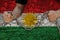 Male hands breaking the iron chain, symbol of tyranny, protest against the background of the national flag Kurdistan, rojava, the