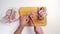 male hands butcher carcass of raw chicken on a wooden cutting board