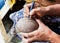 Male hands carving coconut