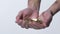 Male hands catching coins in slow motion, lottery winner, social aid, money
