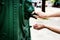 Male hands close-up, unrecognizable tourist washing hands in street fountain