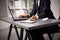 Male hands doing paperwork with pen