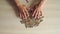 Male hands are drawn to the pile of coins on the table. The theme of financial crisis and poverty